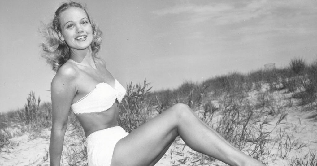 Posing in a vintage bikini on the sand