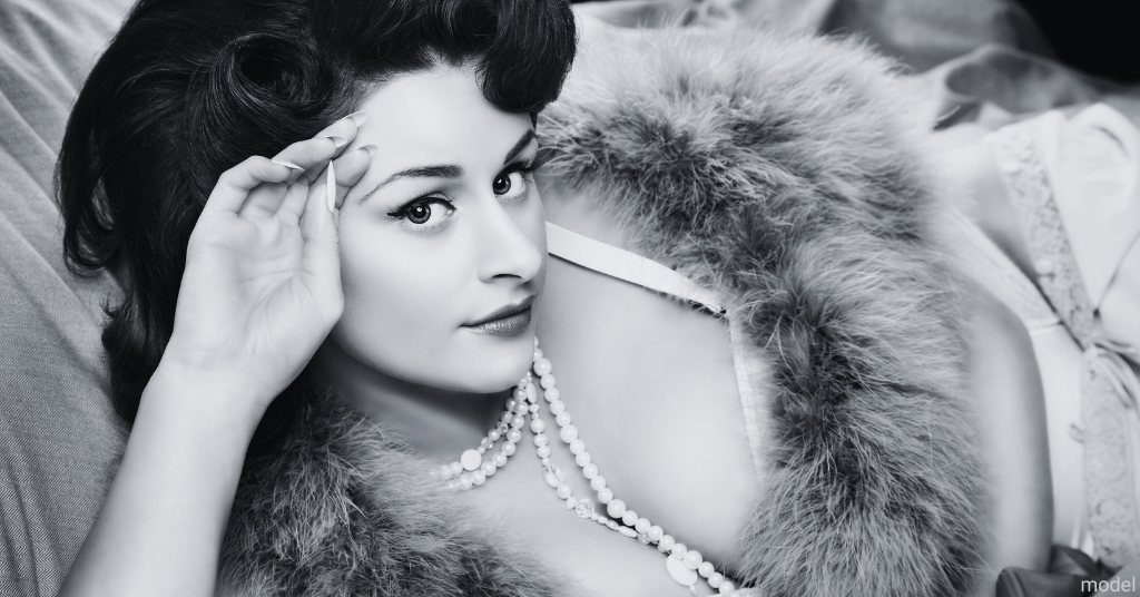 image of 1950's women in black and white wearing a fur coat (model)
