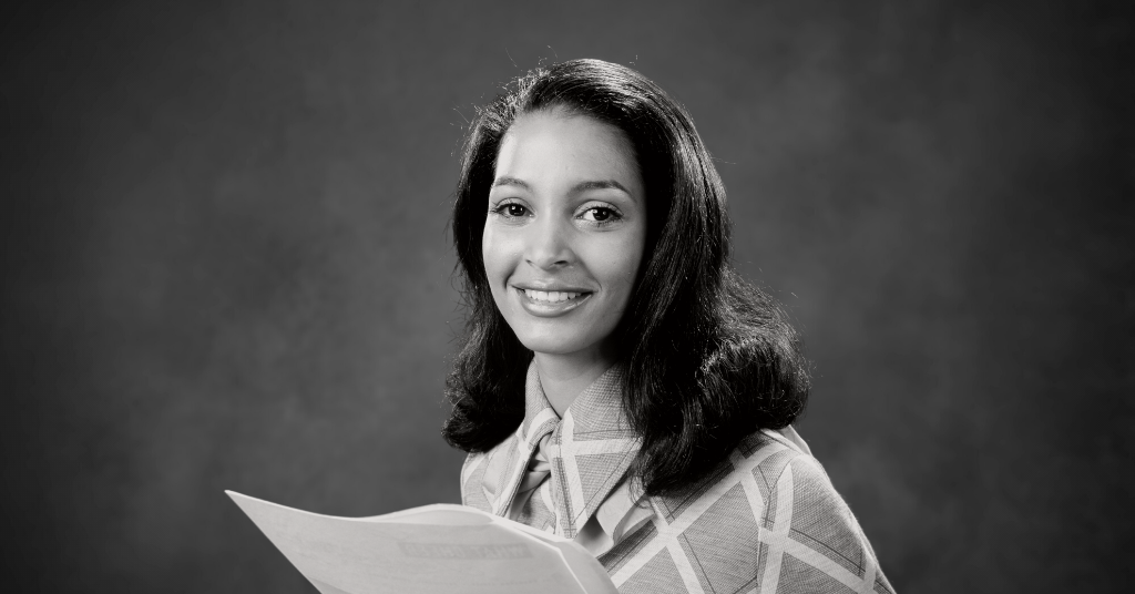 woman smiling after taking quiz (model)