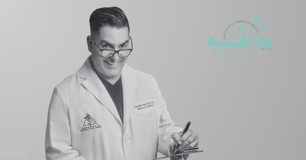 Dr. Armando Soto smiling and writing on a clipboard.