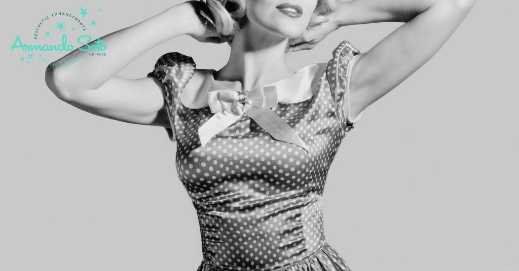 Woman with her hands in her hair (model)