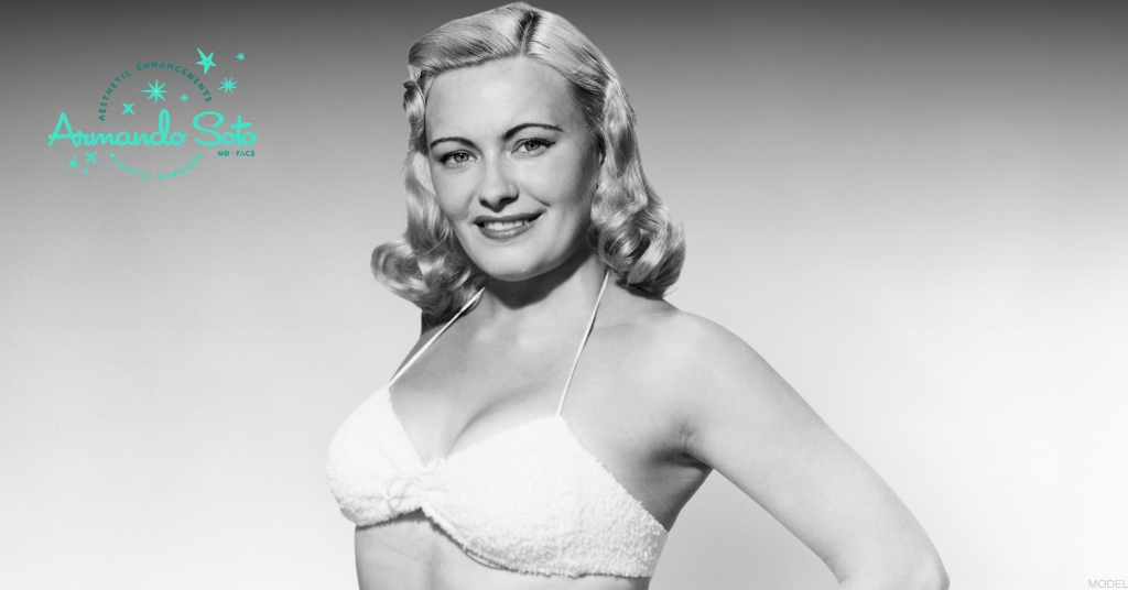 Woman in a bathing suit smiling (MODEL) Aesthetic Enhancements Plastic Surgery & Laser Center: Armando Soto, MD Logo